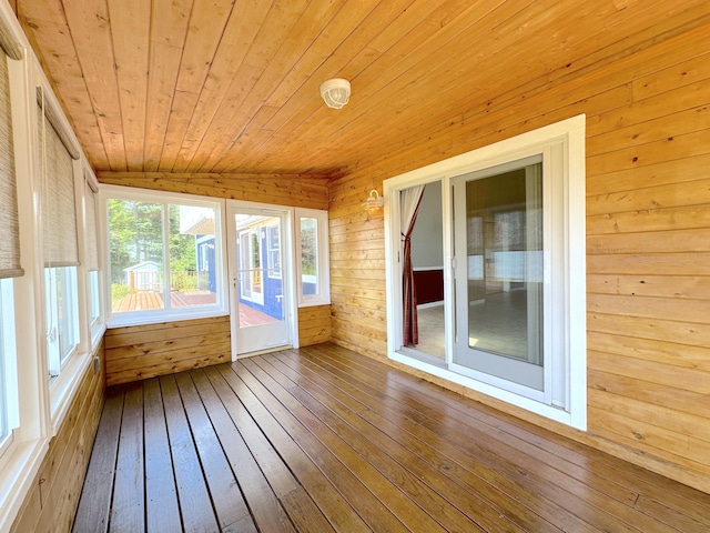 unfurnished sunroom featuring wooden ceiling