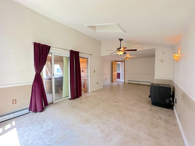 spare room with ceiling fan, baseboard heating, and lofted ceiling