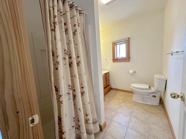 bathroom with toilet, tile patterned floors, vanity, and curtained shower