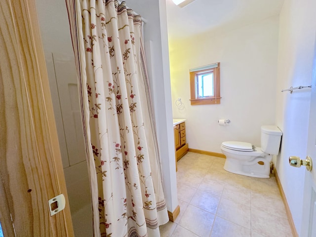 bathroom featuring walk in shower, vanity, and toilet