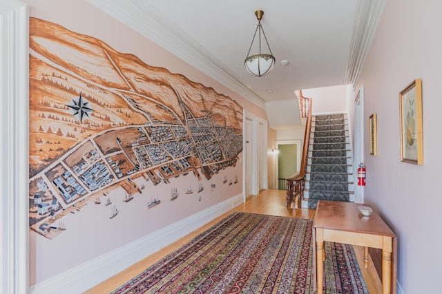 hall featuring hardwood / wood-style flooring and crown molding