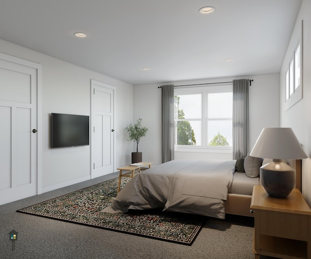 bedroom with speckled floor and recessed lighting