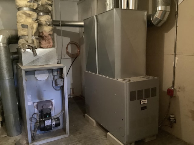 utility room with heating unit