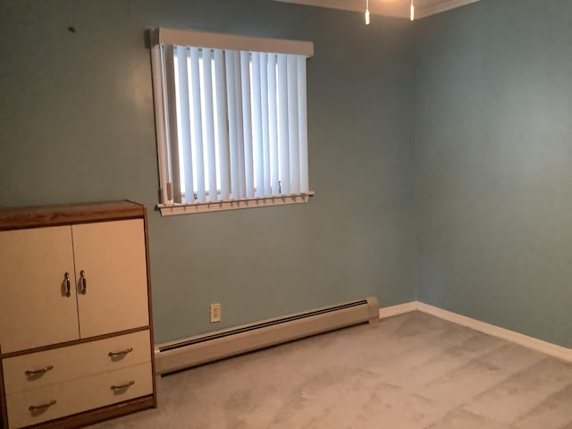 unfurnished bedroom with light carpet and a baseboard radiator