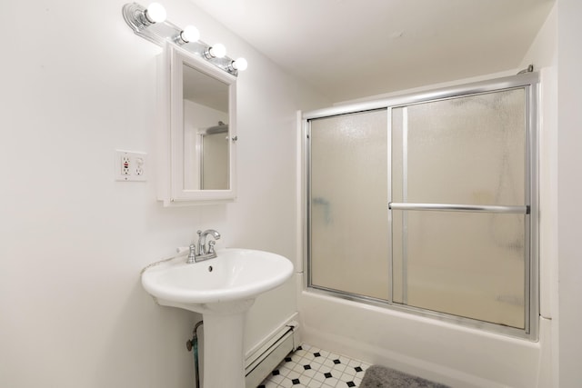 bathroom featuring enclosed tub / shower combo and a baseboard radiator