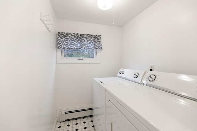 laundry room with laundry area, a baseboard radiator, light floors, and washer and dryer