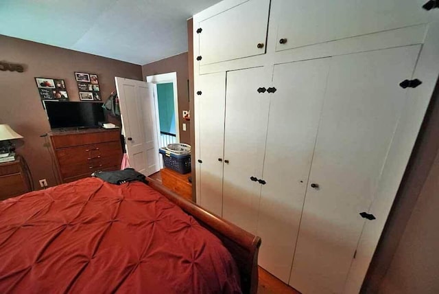 bedroom with hardwood / wood-style floors