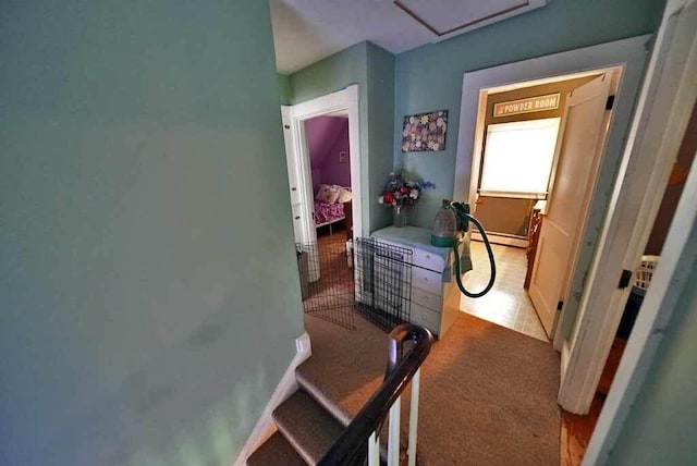 hallway with a baseboard heating unit