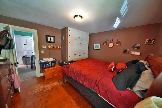 bedroom with hardwood / wood-style floors