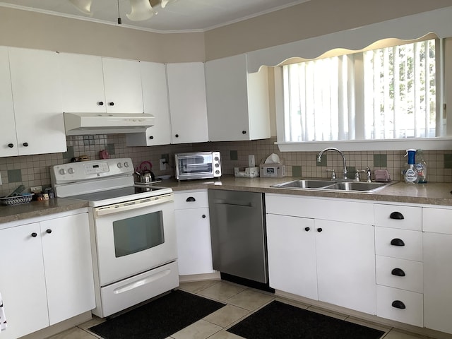 kitchen featuring white cabinetry, a wealth of natural light, dishwasher, and white electric range