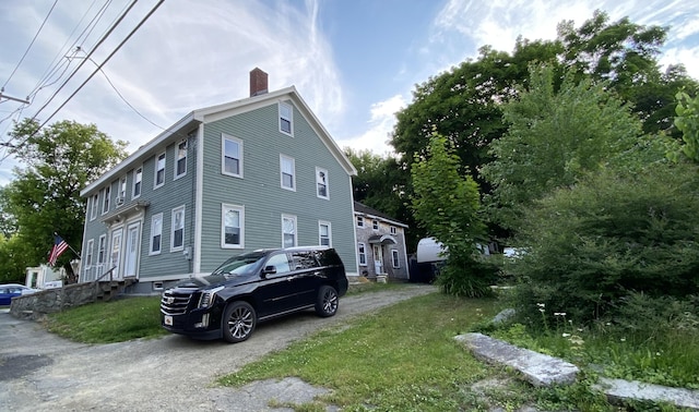 view of home's exterior with a lawn