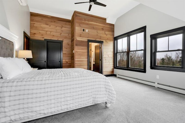 bedroom featuring a baseboard radiator, light carpet, wood walls, a ceiling fan, and vaulted ceiling