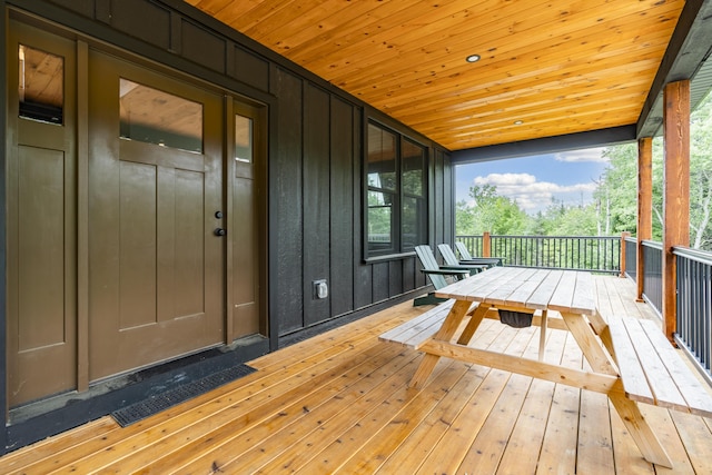 unfurnished sunroom with wooden ceiling