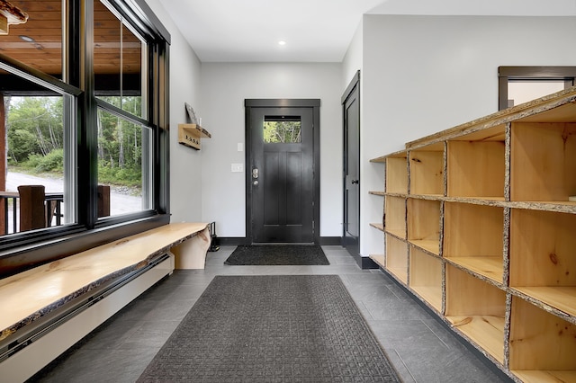 interior space featuring baseboard heating, recessed lighting, and baseboards