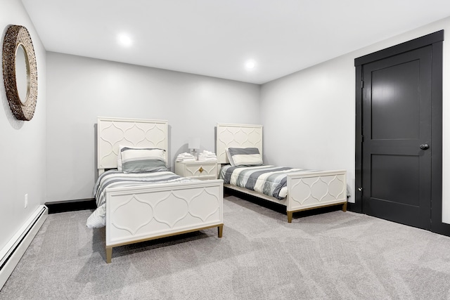 bedroom with carpet floors, recessed lighting, a baseboard radiator, and baseboards