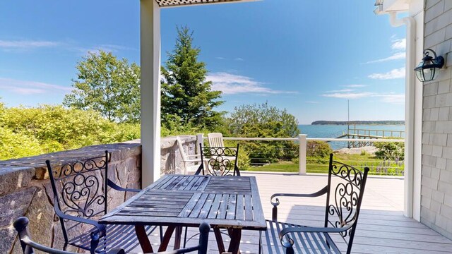 wooden deck with a water view