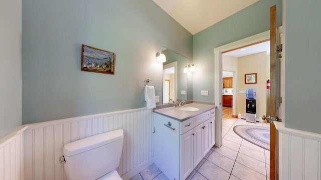 bathroom with tile patterned floors, vanity, and toilet