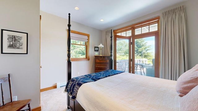 bedroom featuring baseboard heating and access to exterior