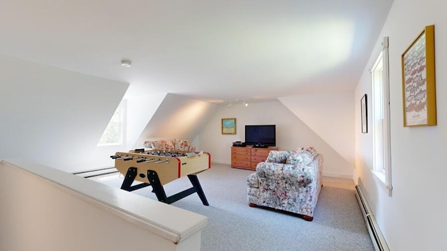 rec room with baseboard heating, a wealth of natural light, carpet, and lofted ceiling