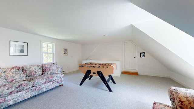 playroom with light colored carpet and vaulted ceiling