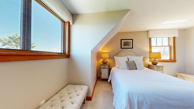 bedroom featuring light carpet