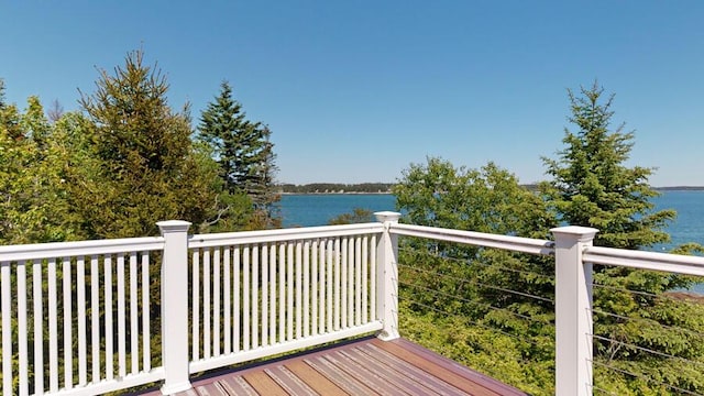 wooden deck featuring a water view