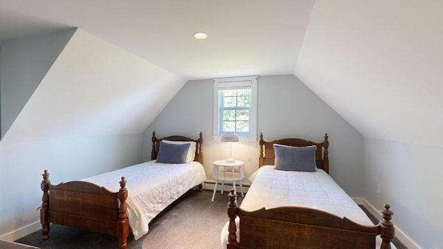 carpeted bedroom featuring lofted ceiling and a baseboard heating unit