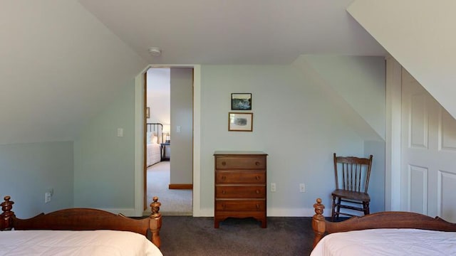 bedroom featuring carpet and lofted ceiling