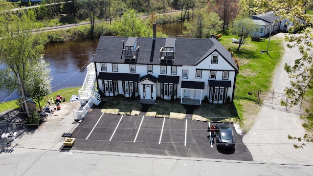 1 Bridge St, Berwick, ME 03901 - view of front of house featuring a water view, uncovered parking, and fence