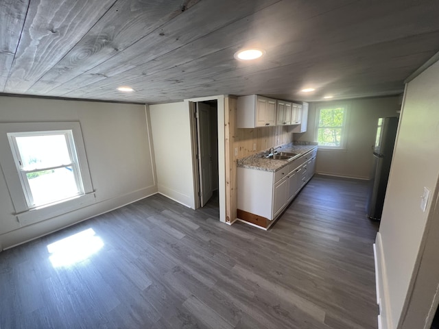 1 Bridge St, Berwick, ME 03901 - kitchen with a sink, freestanding refrigerator, dark wood finished floors, baseboards, and wooden ceiling