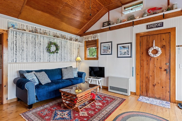 living room featuring heating unit, lofted ceiling, wooden ceiling, and hardwood / wood-style floors