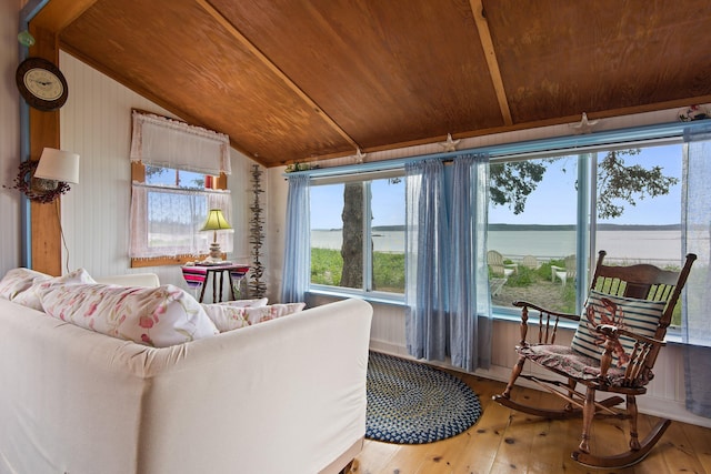 sunroom / solarium with vaulted ceiling, wooden ceiling, and a water view