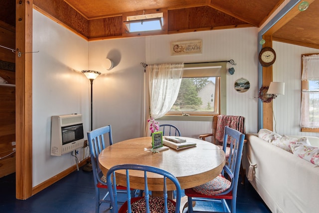 dining space with radiator, dark hardwood / wood-style floors, heating unit, and lofted ceiling with skylight