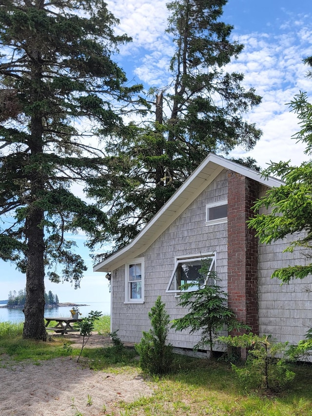 view of property exterior featuring a water view