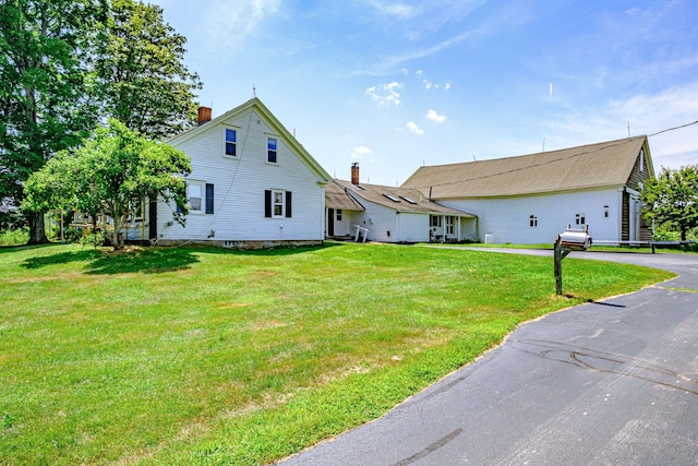 exterior space with a front yard