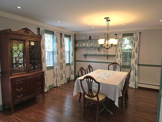 dining area with a chandelier, dark hardwood / wood-style flooring, crown molding, and a baseboard heating unit