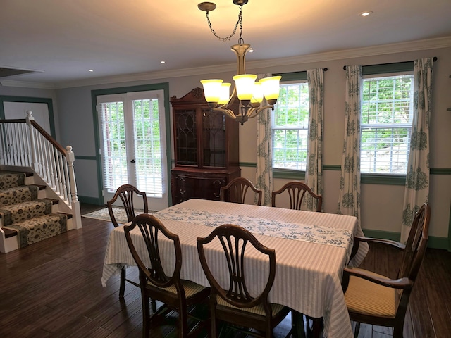 dining space with a chandelier, crown molding, a healthy amount of sunlight, and dark hardwood / wood-style floors