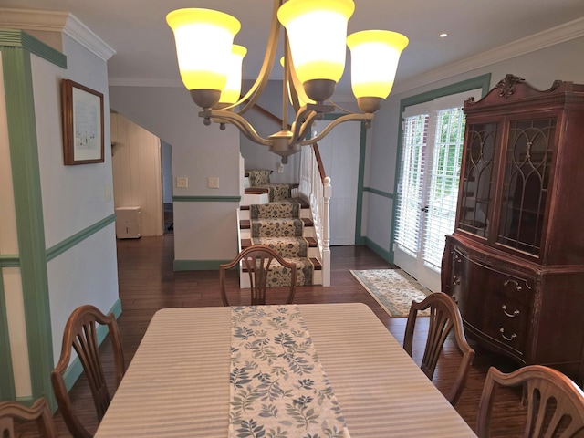 dining room with dark hardwood / wood-style flooring, french doors, crown molding, and a chandelier