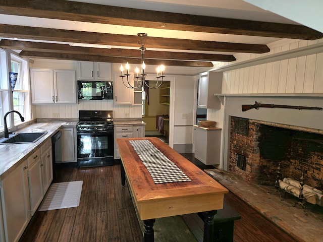 kitchen featuring black appliances, white cabinets, sink, hanging light fixtures, and dark hardwood / wood-style floors