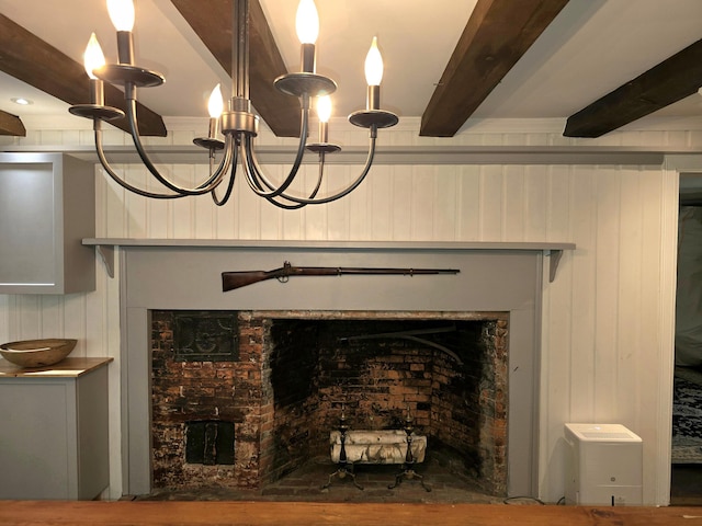 room details with wood walls, beamed ceiling, and an inviting chandelier