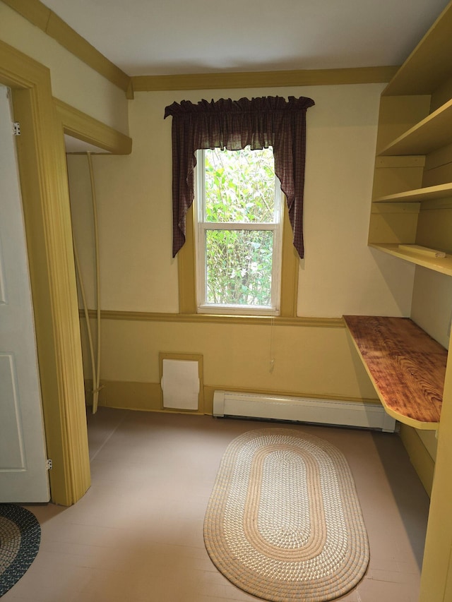 interior space with a baseboard radiator