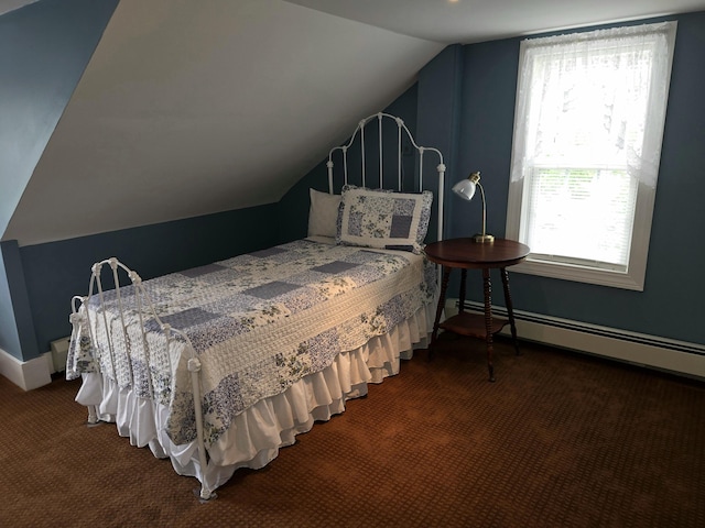 bedroom featuring dark colored carpet, vaulted ceiling, and baseboard heating