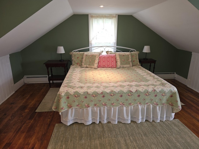 bedroom with a baseboard heating unit, dark hardwood / wood-style flooring, and lofted ceiling