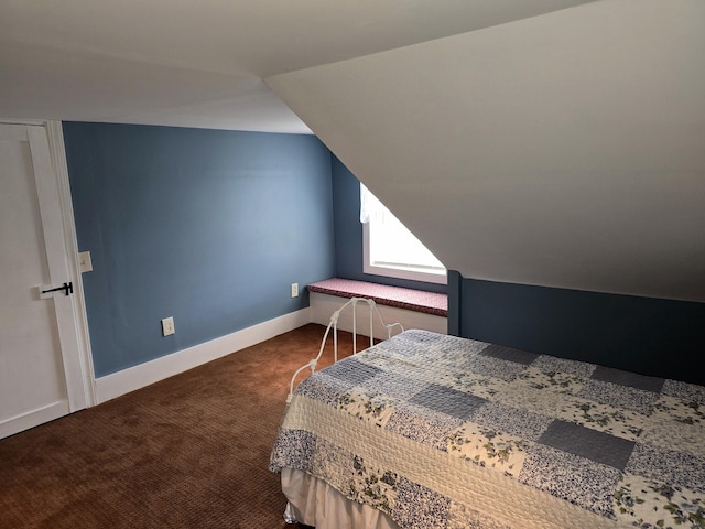 carpeted bedroom featuring lofted ceiling