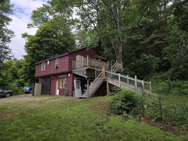 view of property exterior with a wooden deck