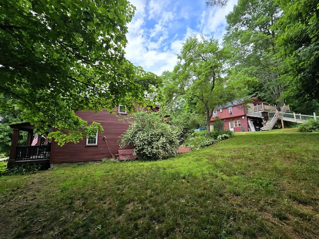 view of yard featuring a wooden deck