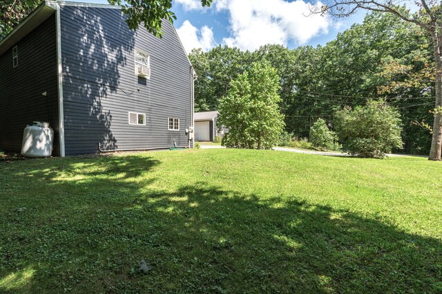 view of yard with a detached garage