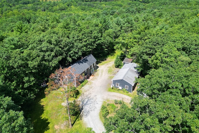 bird's eye view featuring a wooded view