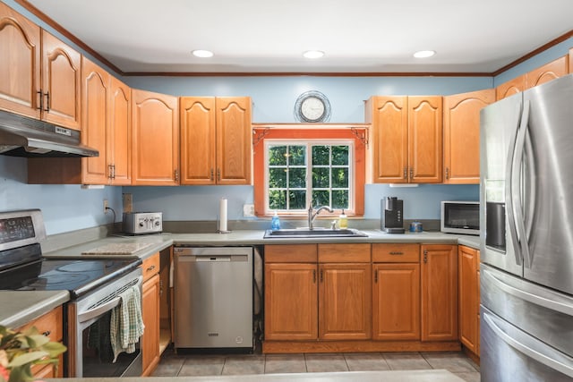 kitchen with light countertops, recessed lighting, stainless steel appliances, under cabinet range hood, and a sink
