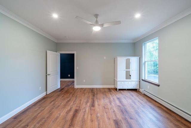 unfurnished bedroom with ceiling fan, wood-type flooring, crown molding, and a baseboard heating unit